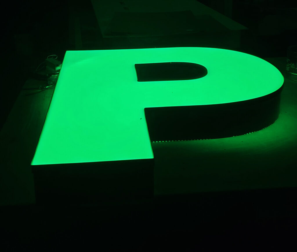 Neon green illuminated letter P